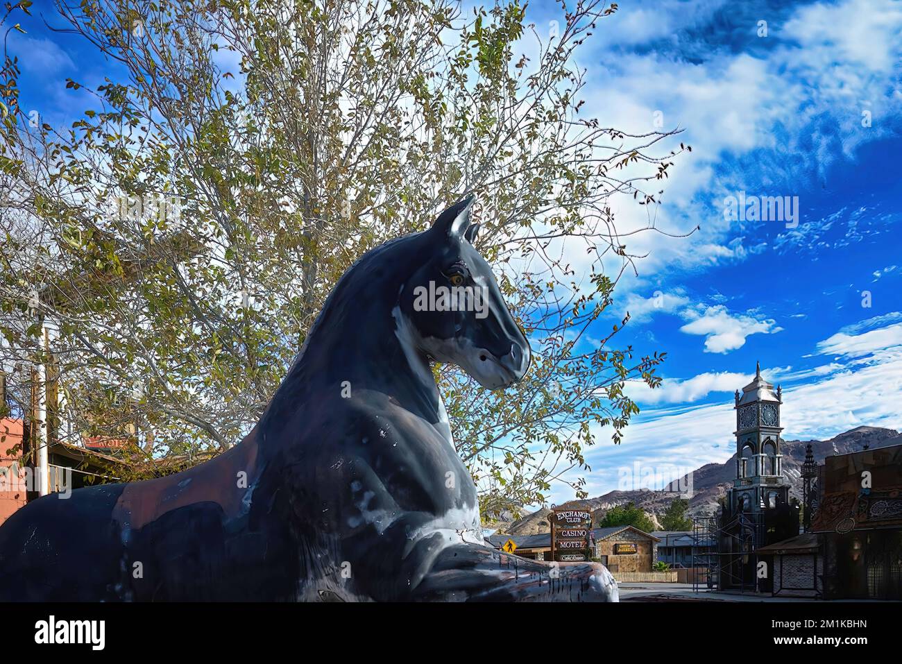 A scene of an abandoned Ghost Town with a black horse statue with a  Death Valley, Beatty, Nevada, USA Stock Photo