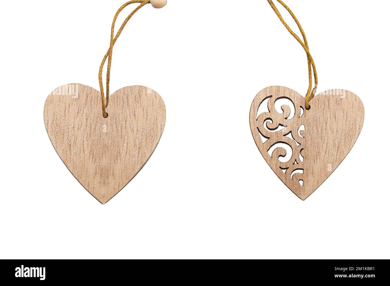 Two wooden hearts with rope, carved ornament on white isolated background. Design element. Valentine's Day Stock Photo