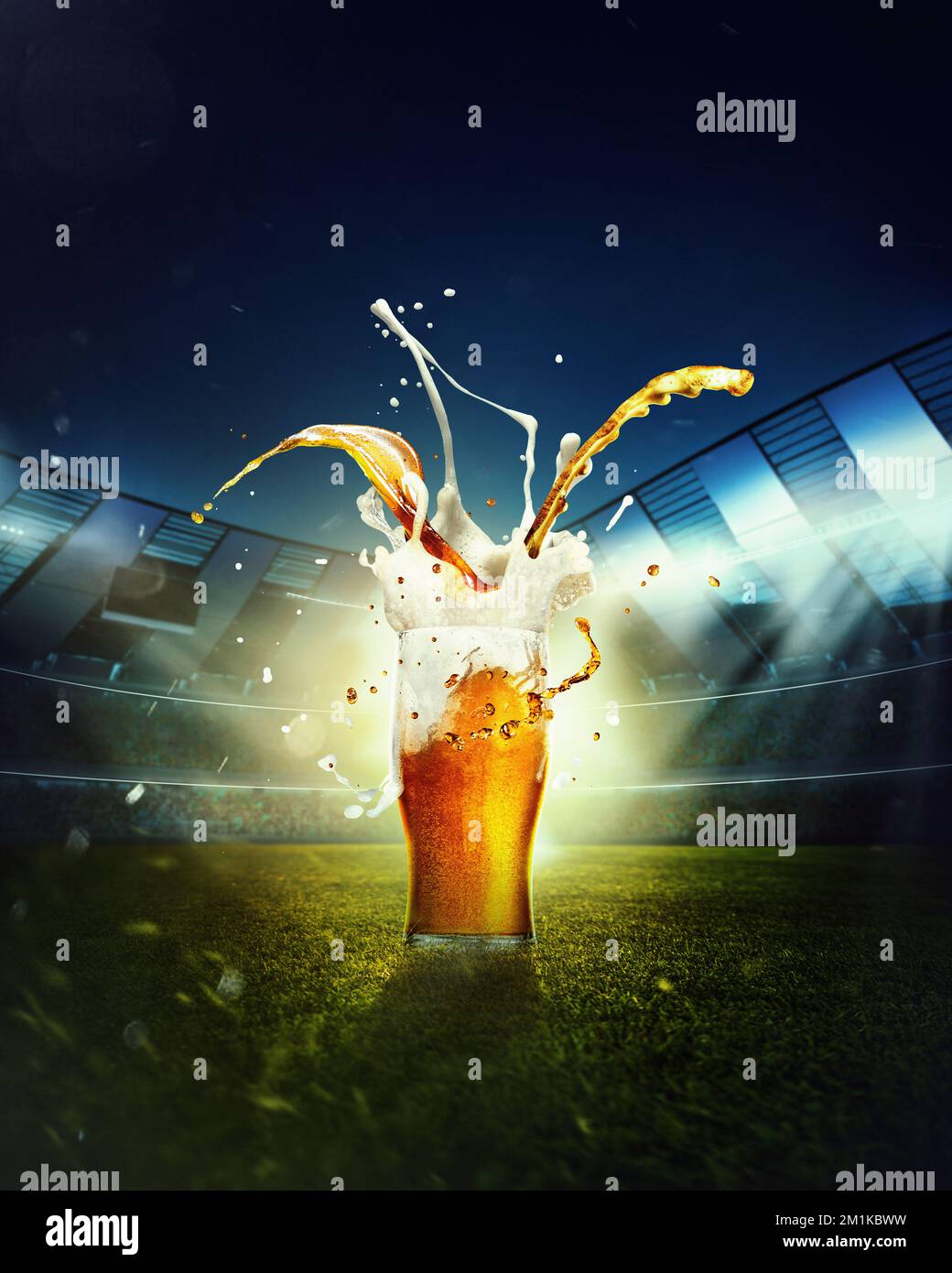 Beer and foam splashes. Mug with lager beer standing on grass at football stadium over evening sky with flashlights Stock Photo