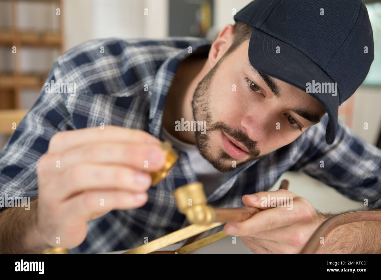 industrial worker using propane gas torch for soldering copper pipes
