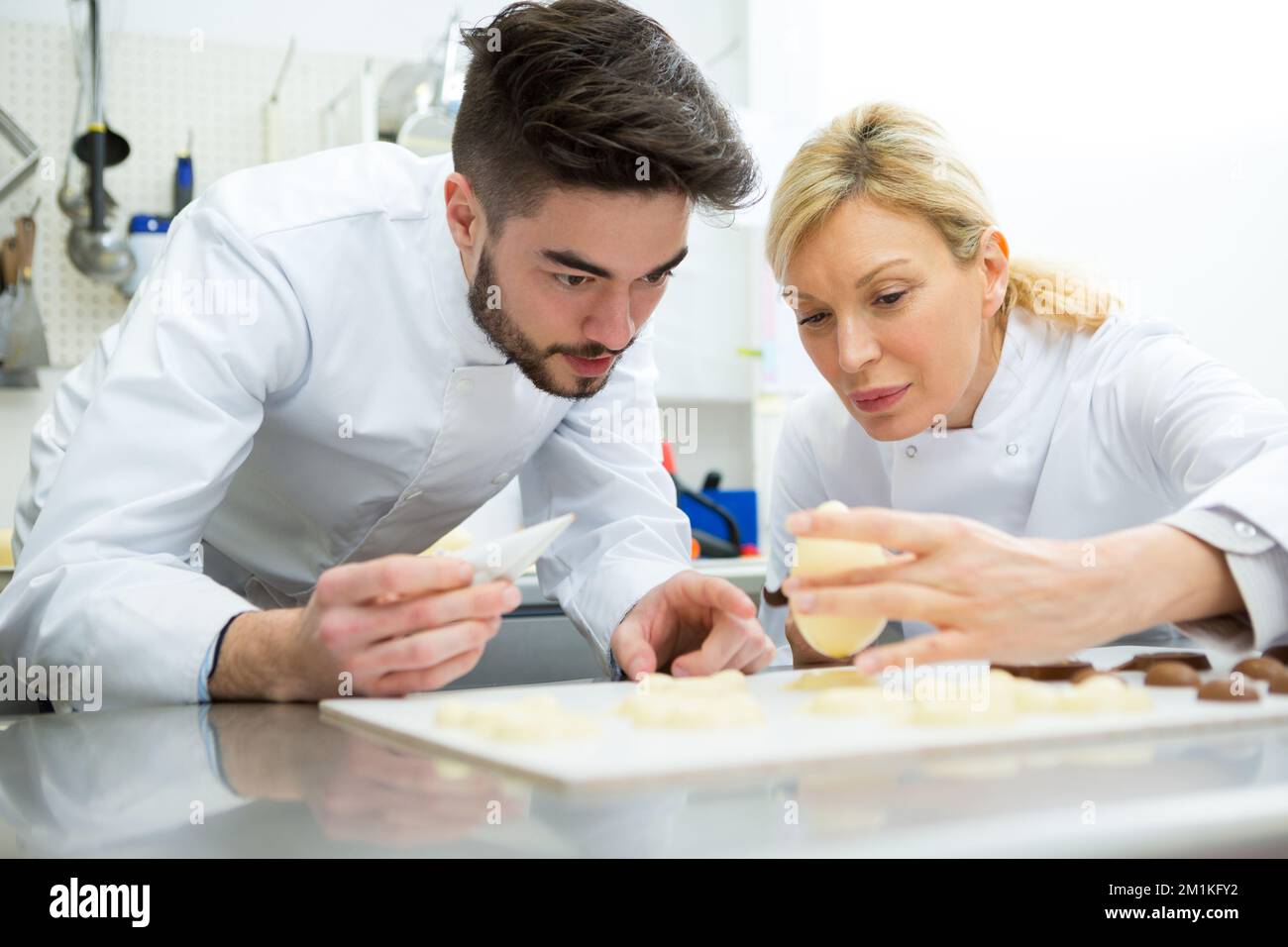 working on chocolate eggs Stock Photo