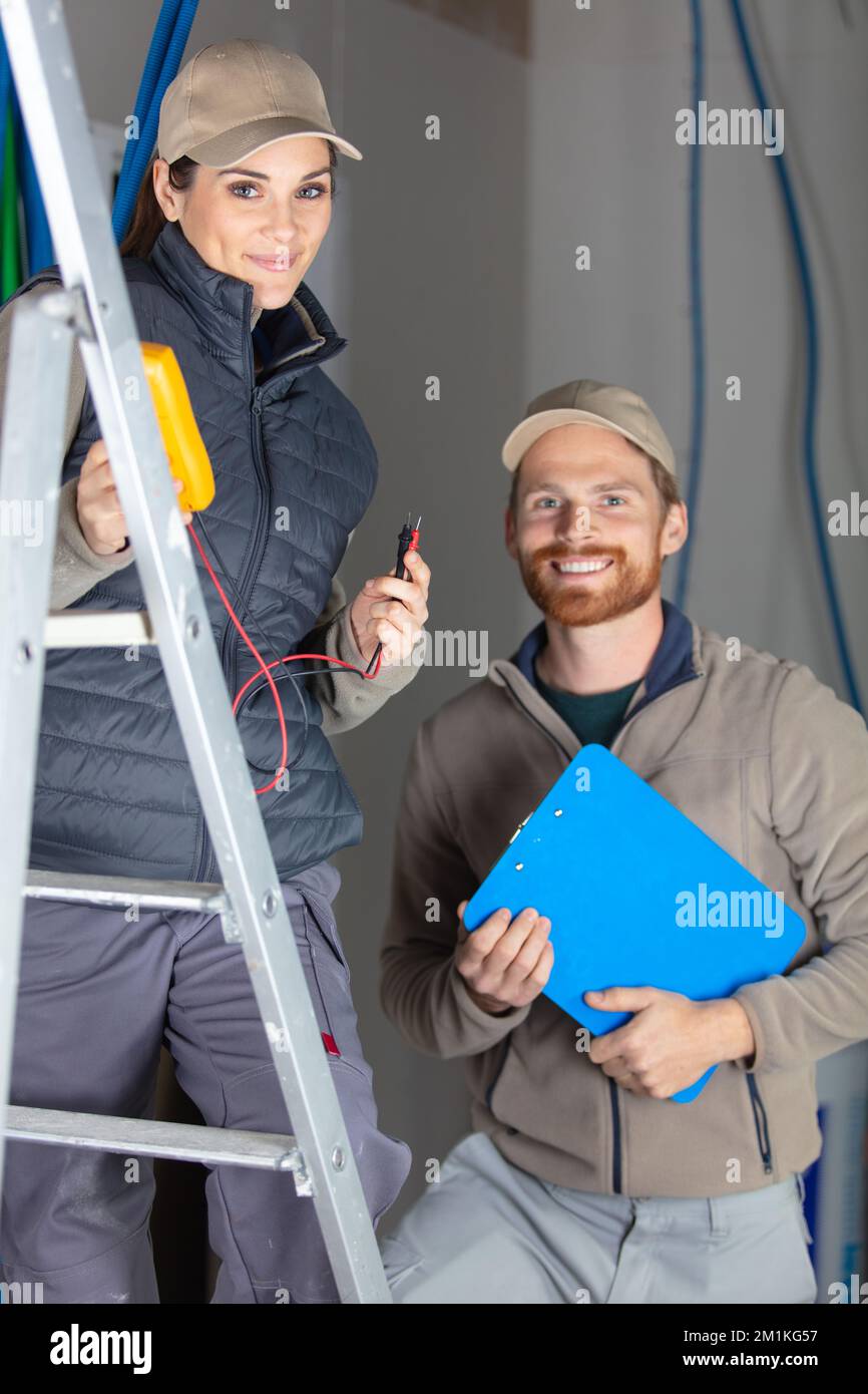 male and female colleagues on construction site Stock Photo