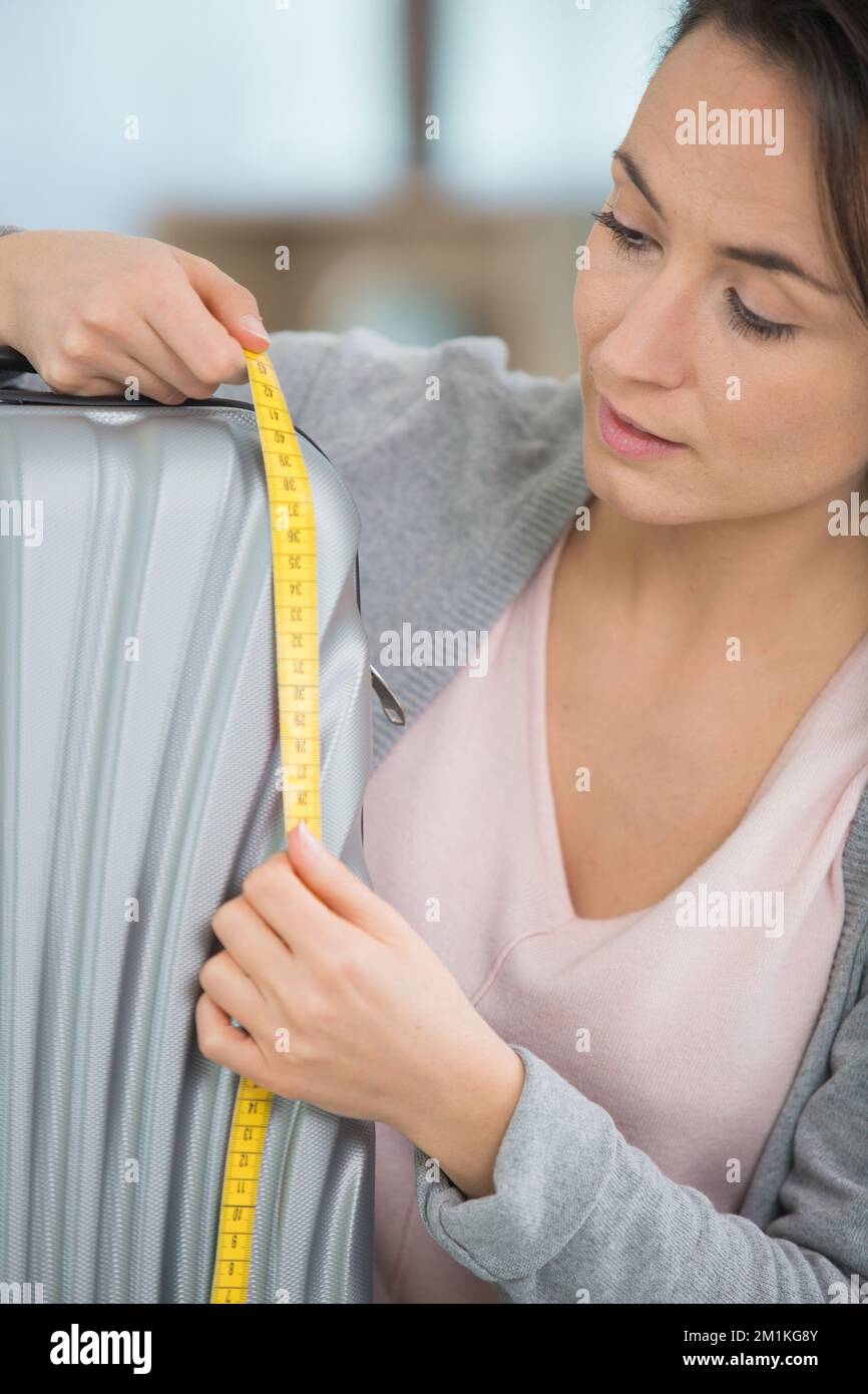 Beautiful and young seamstress with a measuring tape on her neck Stock  Photo by ©stockufa 349262122