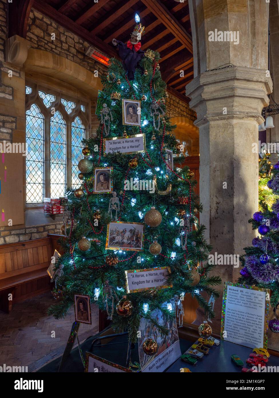Decorated trees in the annual Christmas Tree Festival in the church of St John the Baptist, Piddington, Northamptonshire,. UK Stock Photo