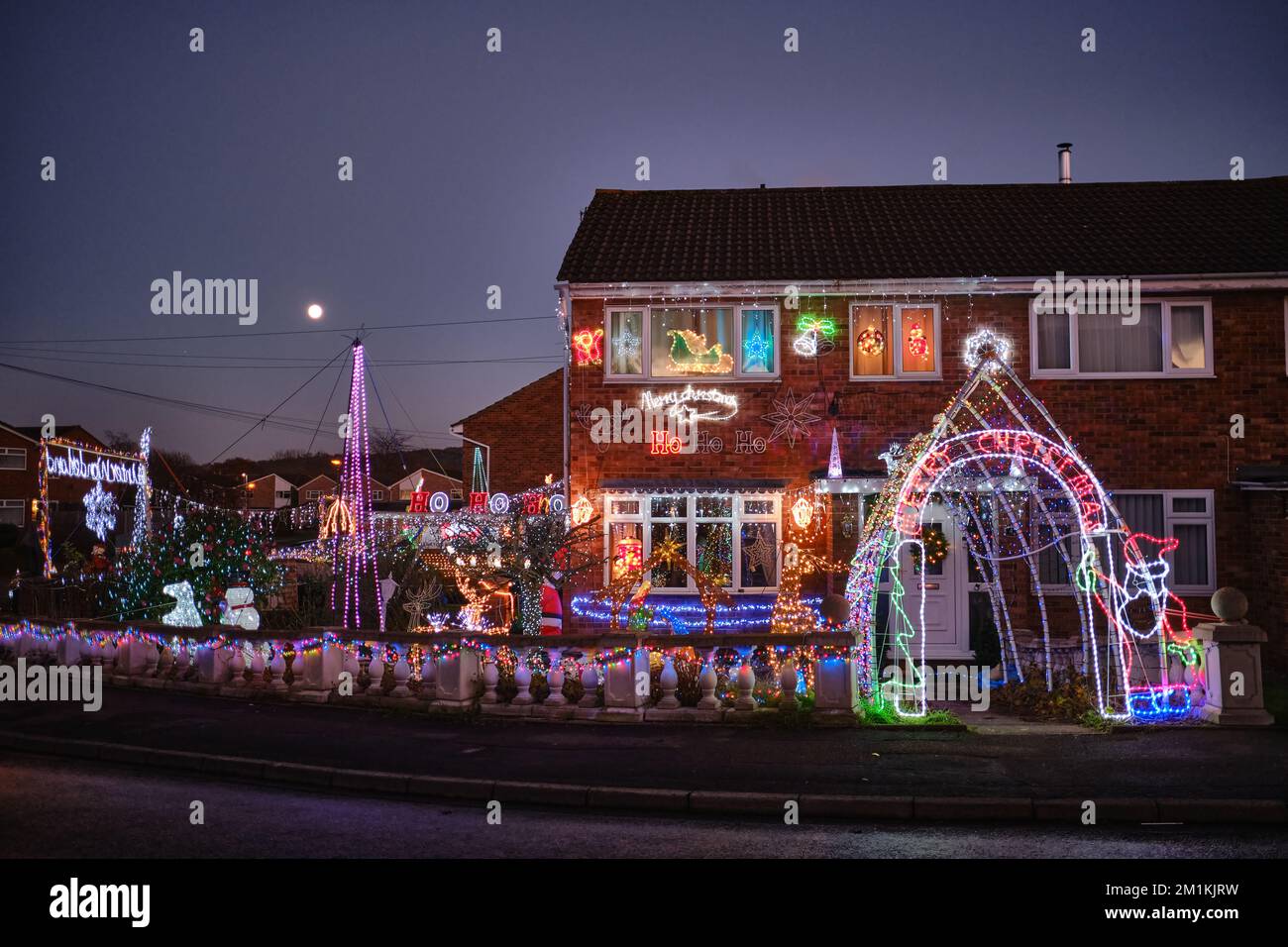 Christmas lights in the front garden of a house in England Stock Photo