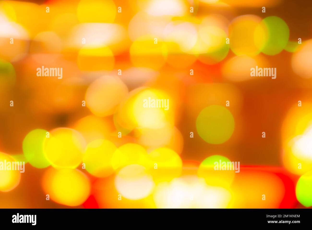 Blur gold, green, and red color bokeh background. Blur abstract background for Christmas day. Light with a beautiful pattern of round bokeh. Orange Stock Photo