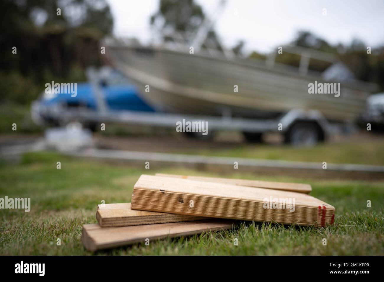wood chocks for a caravan and camping. chocks behind a tyre. camping