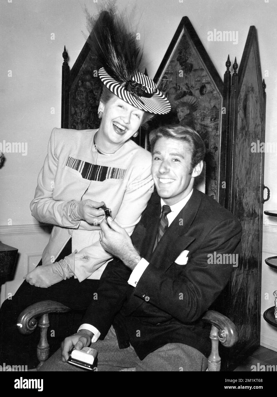 Hollywood Gossip Columnist HEDDA HOPPER and Actor PETER LAWFORD candid