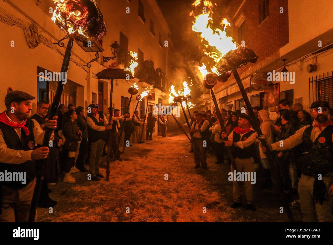 December 13, 2022: December 13, 2022 (Casarabonela, Malaga) los Rondeles, declared festival of National Tourist Interest of Andalusia, a mixture of tradition and popular fervor. The whole town took to the street to accompany the Divine Shepherd to the light of the capachos caught by the streets of the municipality. Already in the eighteenth century, the millers of Casarabonela took out in procession the Divina Pastora to thank her for the harvest. And they did it as in no other part of the world: year after year, every year on December 12, the eve of Saint Lucia, whether it was a feast or a wo Stock Photo