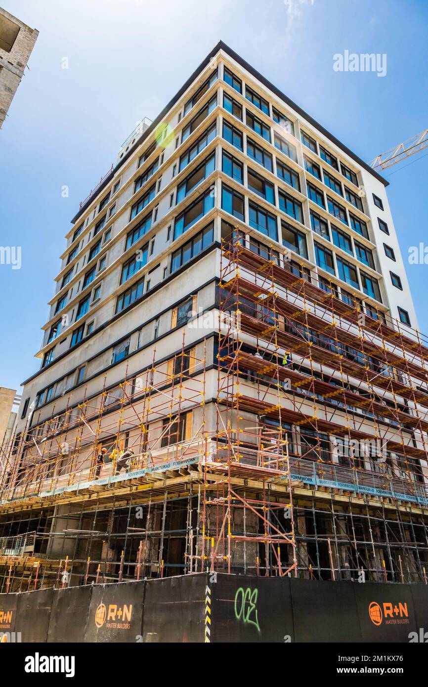 Cape Town, South Africa - December 7, 2022: Construction workers on scaffolding on building site Stock Photo