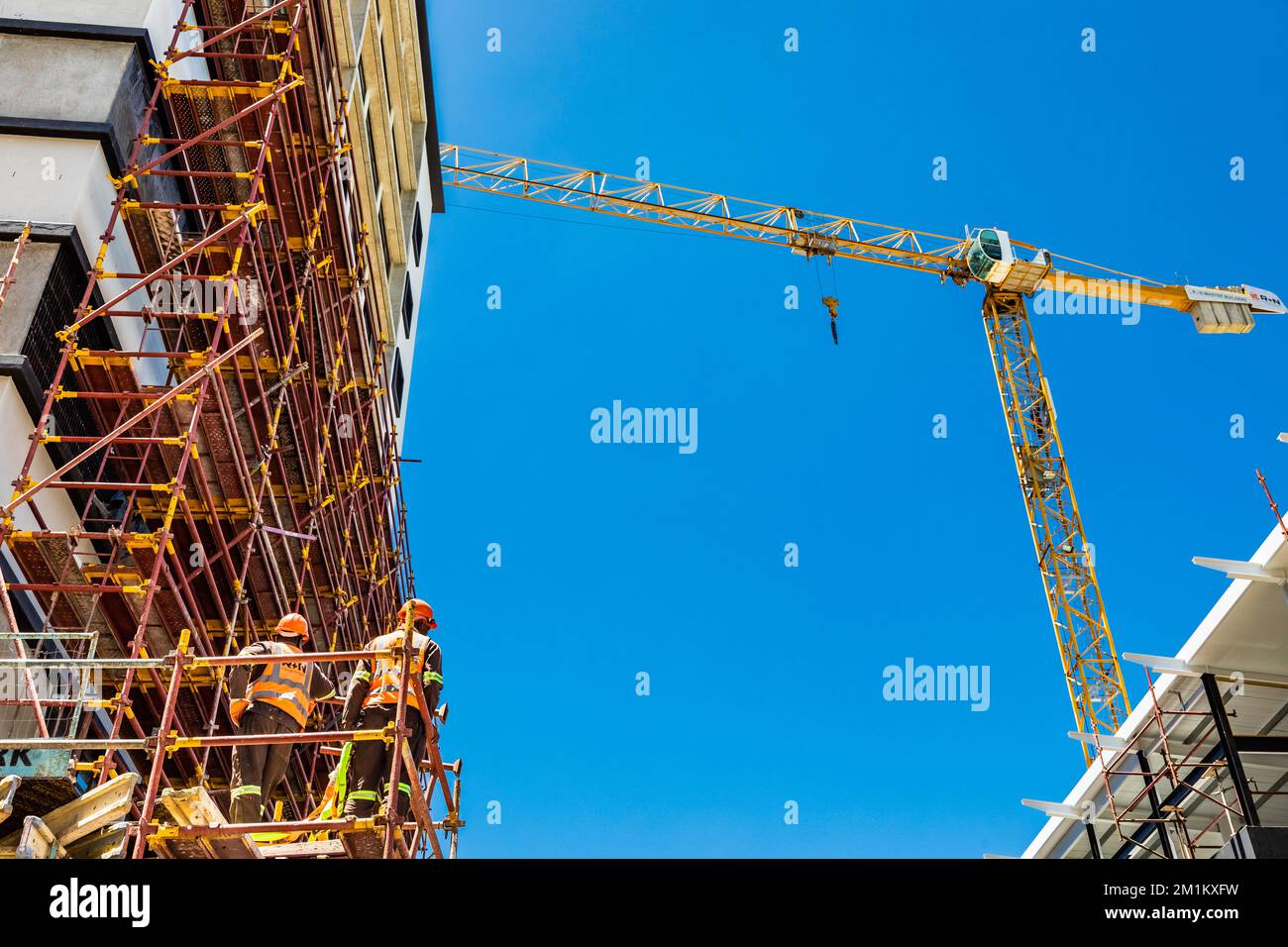 Cape Town, South Africa - December 7, 2022: Building construction site with large crane Stock Photo