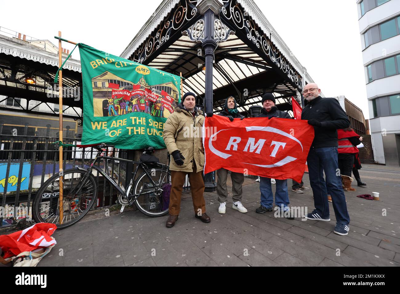 Brighton, UK. 13th Dec, 2022. Striking members of the RMT Union stand