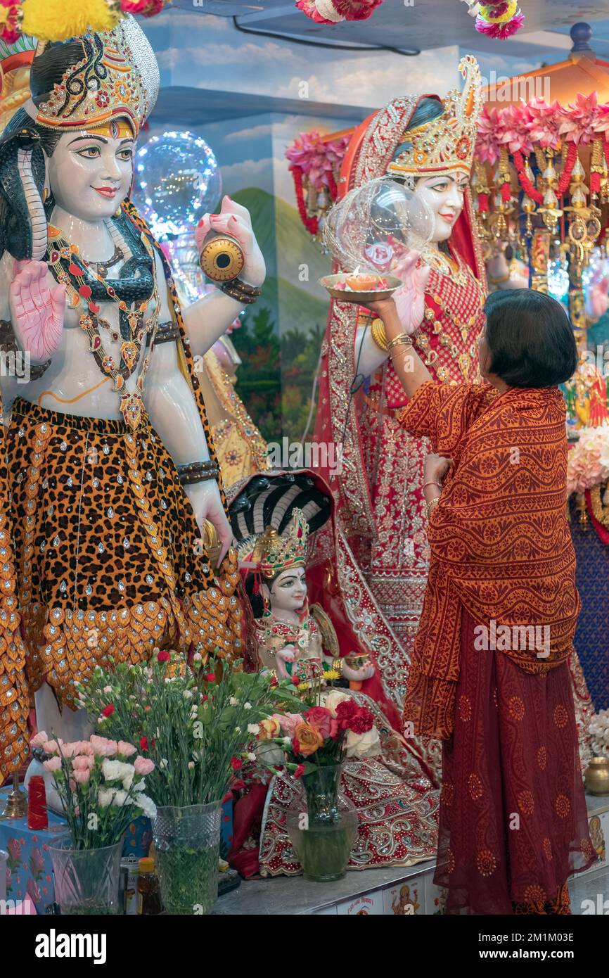 A devout Hindu worshipper performs the ritual of art by waving a flame