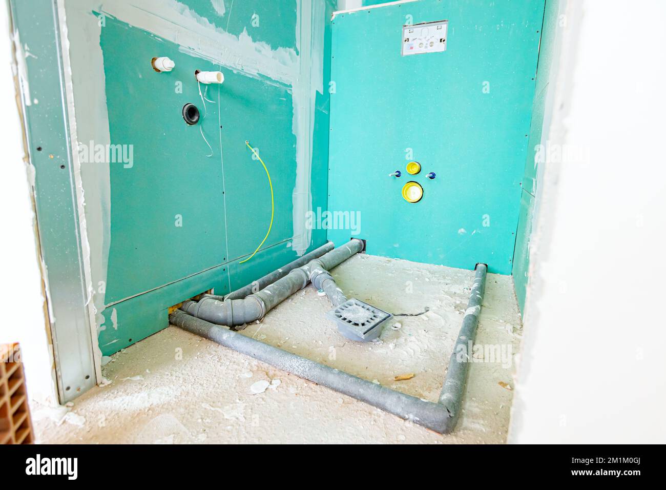 View of Water installation in the new unfinished bathroom, exposed mounted grey ...