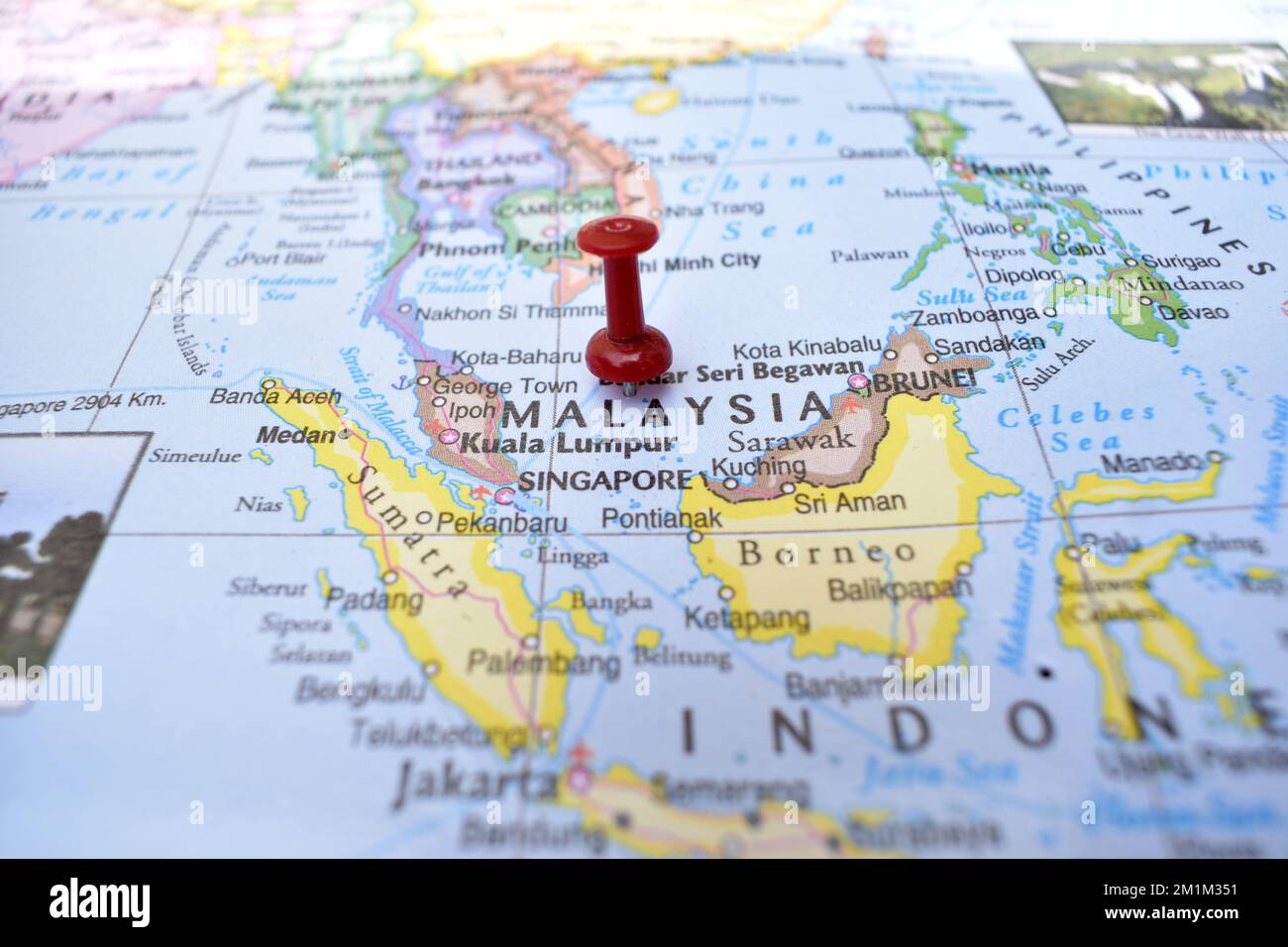 Red Push Pin Pointing on Location of Malaysia World Map CloseUp View