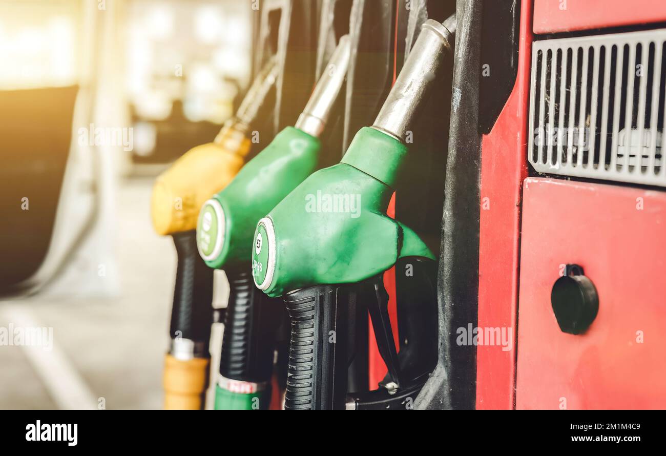 Petrol pump filling nozzles at Gas station Stock Photo Alamy