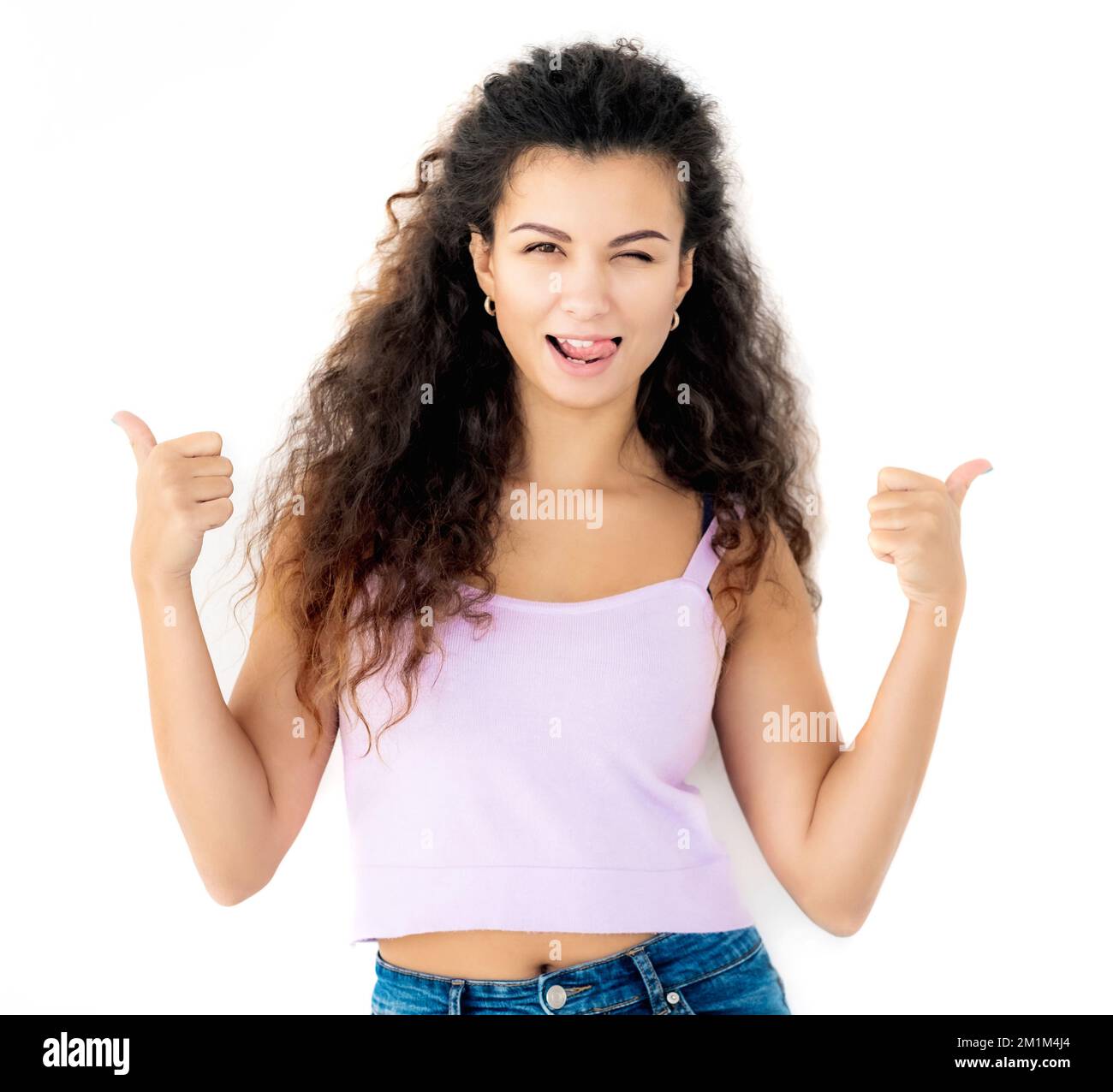 Girl showing thumbs up Stock Photo - Alamy