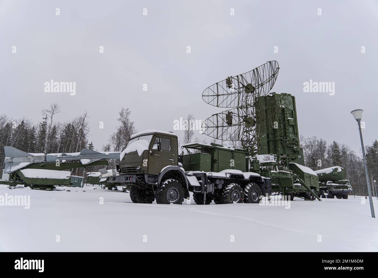 Heavy military equipment of the Russian armed forces against the background of a winter forest. Radio intelligence Stock Photo