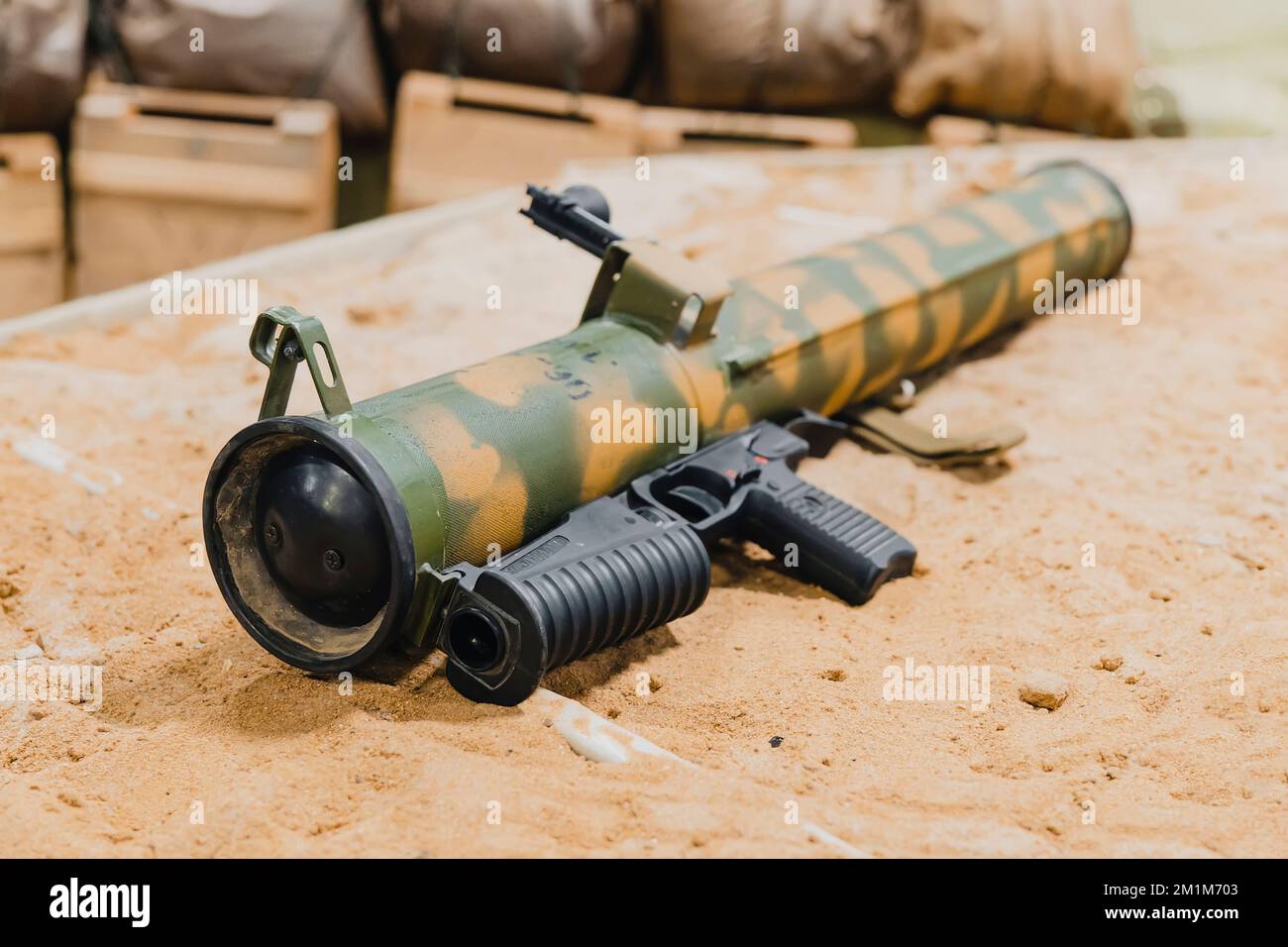 Military, Shooting RPG anti tank grenade launcher lying on the sand. war trophy. military supplies of heavy weapons Stock Photo
