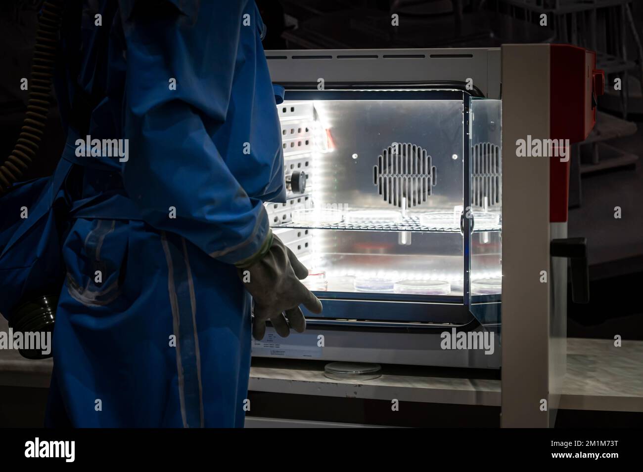 Manufacturing Lab Assistant Laboratory assistant during work. Concept - man works in a modern ...