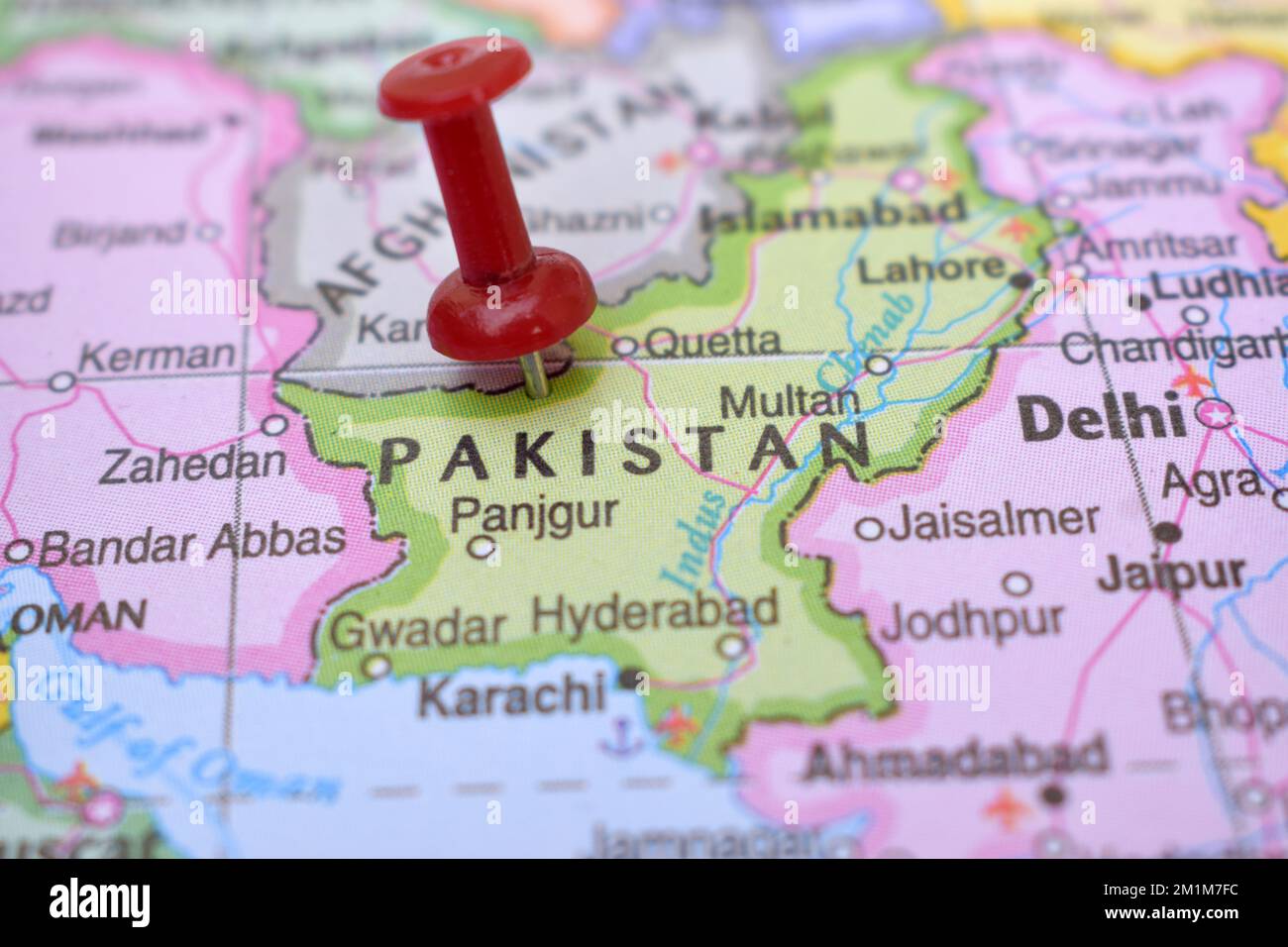 Red Push Pin Pointing on Location of Pakistan World Map Close-Up View Stock Photograph Stock Photo