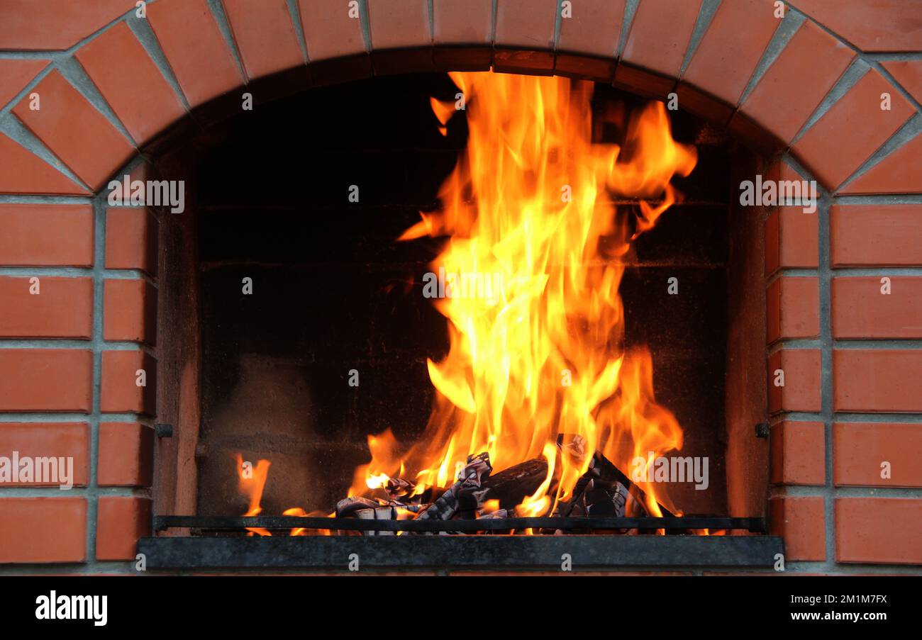 Fireplace Of Brick Oven With Burning Logs Stock Photo Alamy