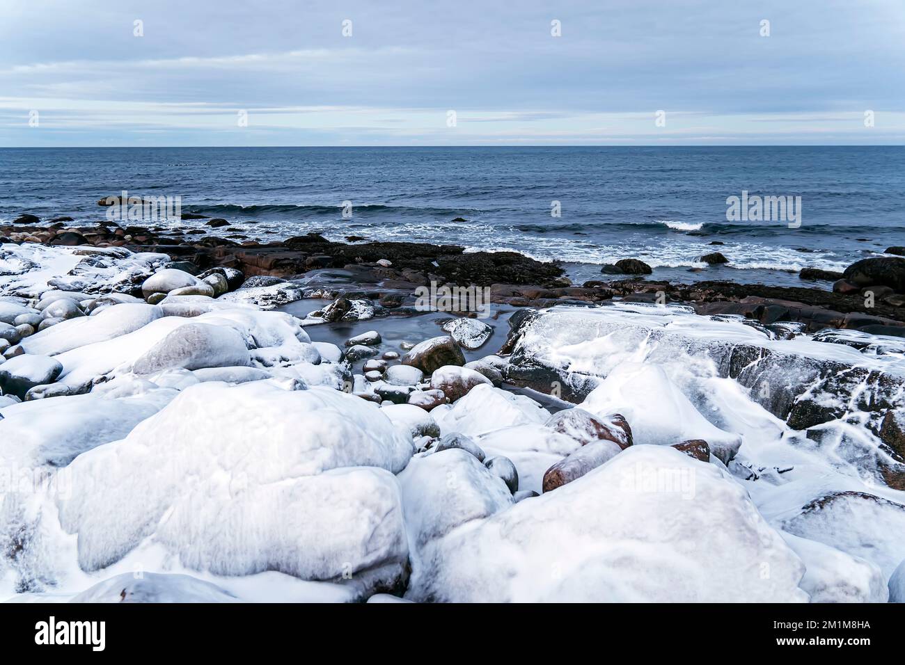 Snowfall Ocean Winter landscape with mountains and snow in a polar day, the Arctic ...