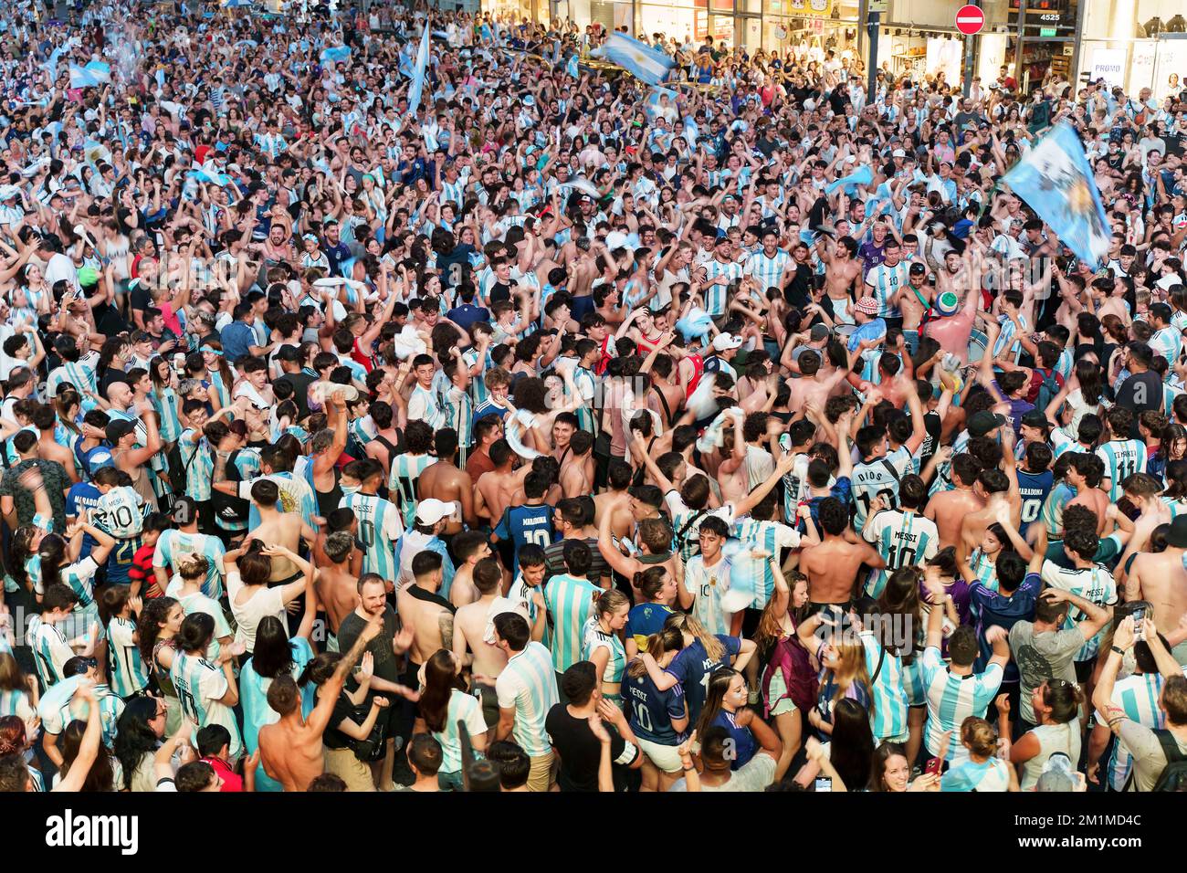 Buenos Aires, Argentina - December 9, 2022: Happy Argentine football fans celebrate winning a football match at the Qatar 2022 FIFA World Cup. High quality photo Stock Photo