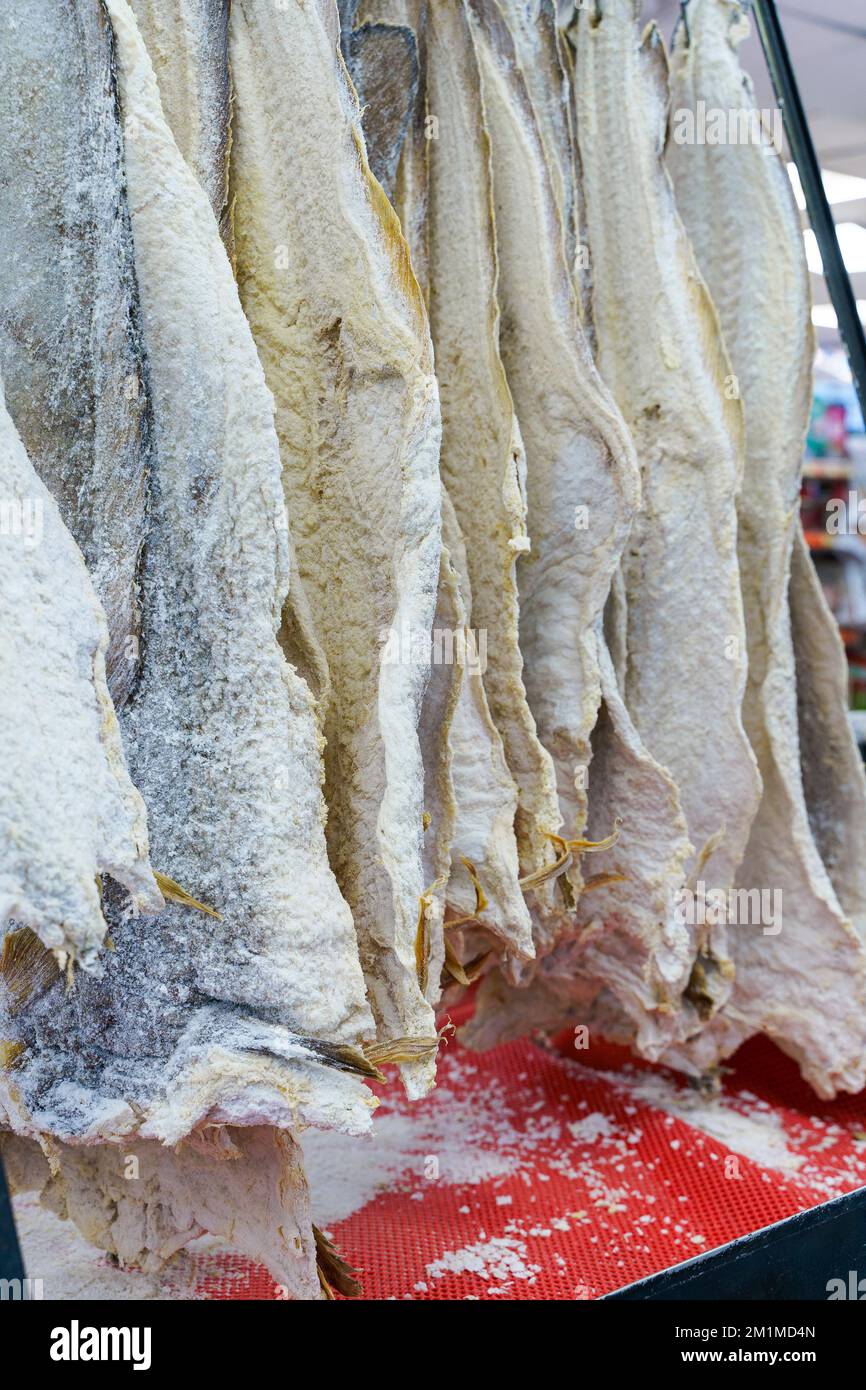 Salted dried cod bacalao on the counter of a fish store. Traditional