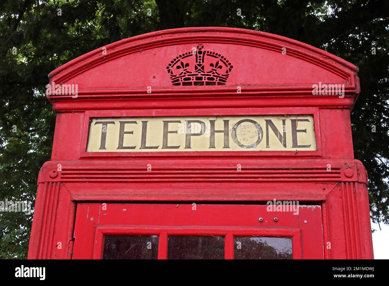 Red British Public Telephone box, K2 Giles Gilbert Scott red telephone box, in Regents Park, North London, England, UK, NW1 4NR Stock Photo