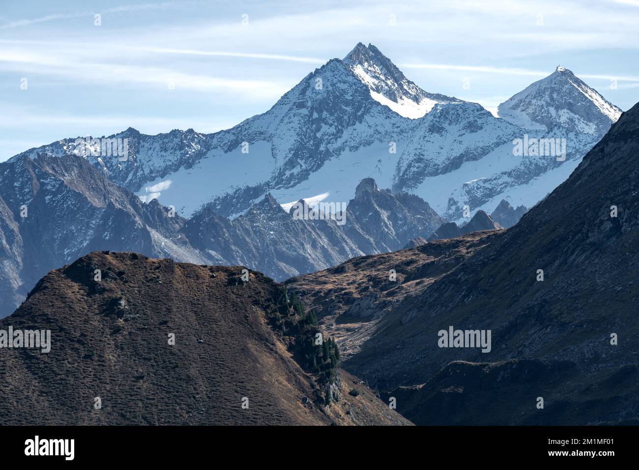 Reichenspitze and Kuchelmooskopf peaks covered in snow and ice on a beautiful sunny day of autumn in Austrian Alps. Dramatic cliffs of Alpine moutains Stock Photo