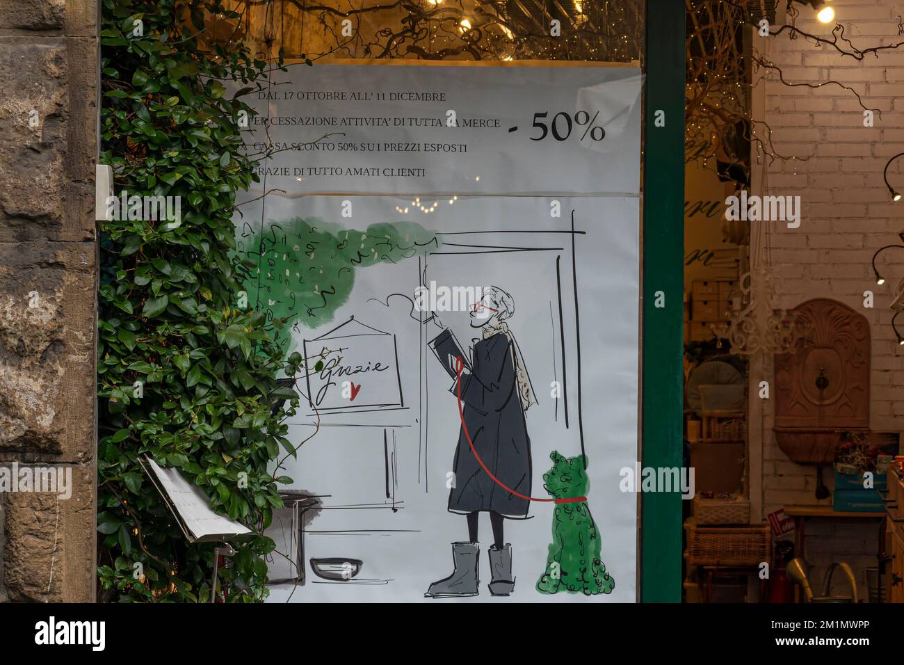 Advert on shop front in Florence Italy Stock Photo