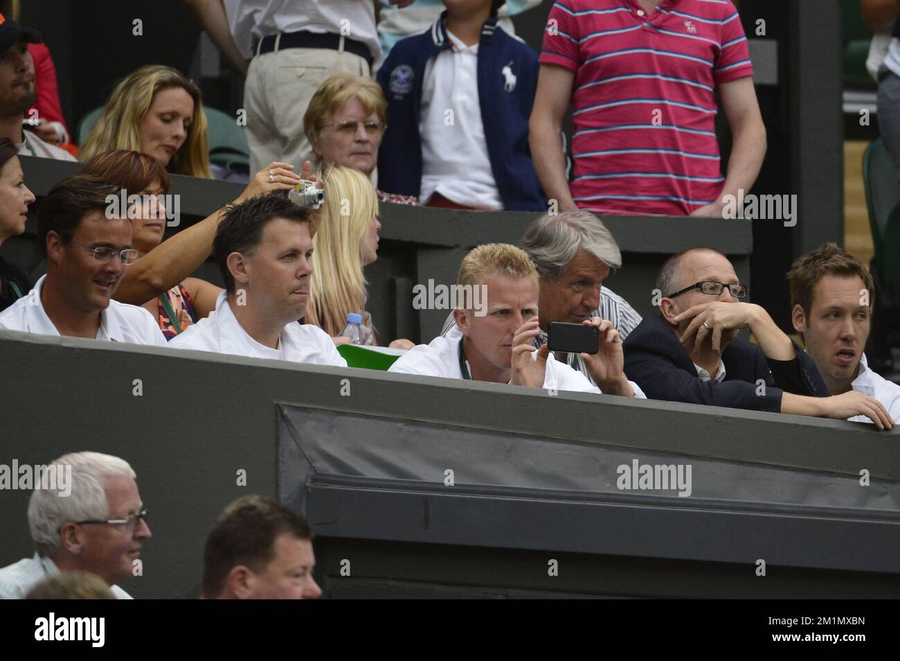 20120627 - LONDON, UNITED KINGDOM: Clijsters' coach Carl Maes, Clijsters' physiotherapist Sam Verslegers and Clijsters' sparing partner Stefan Wauters pictured in the stands, during the second round match between Belgian Kim Clijsters (WTA 47) and Czech Andrea Hlavackova (WTA 90) at the 2012 Wimbledon grand slam tennis tournament at the All England Tennis Club, in southwest London, Wednesday 27 June 2012.  BELGA PHOTO DIRK WAEM Stock Photo