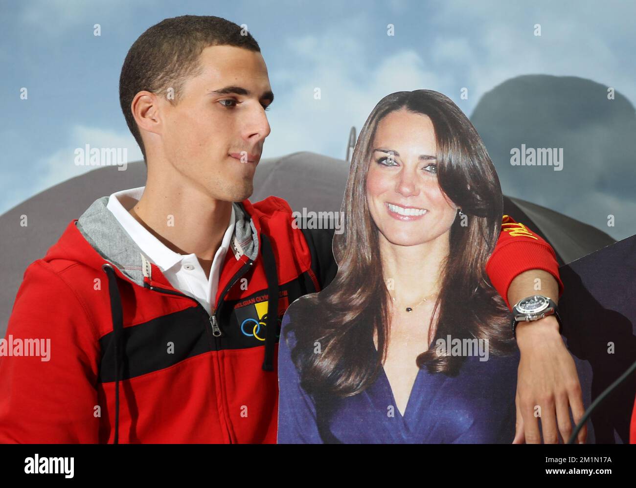 20120712 - BRUSSELS, BELGIUM: Athlete Kevin Borlee poses with a cardboard  picture of princess Kate Middleton and Prince William during a press  conference regarding the Belgian participation in the different athletics  disciplines, image size:1300x998