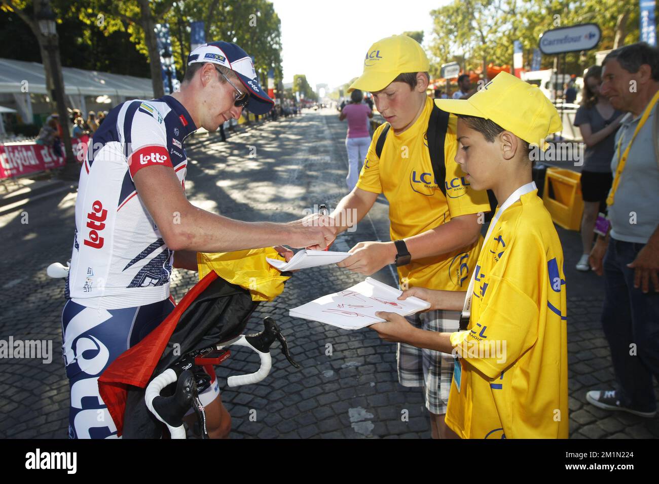 20120722 - PARIS, FRANCE: Belgian Jurgen Van den Broeck of Lotto Belisol Team signs an autograph before the 20th and last stage of the 99th edition of the Tour de France cycling race, 130km from Rambouillet to the Champs-Elysees, Paris, France, Sunday 22 July 2012. BELGA PHOTO KRISTOF VAN ACCOM Stock Photo