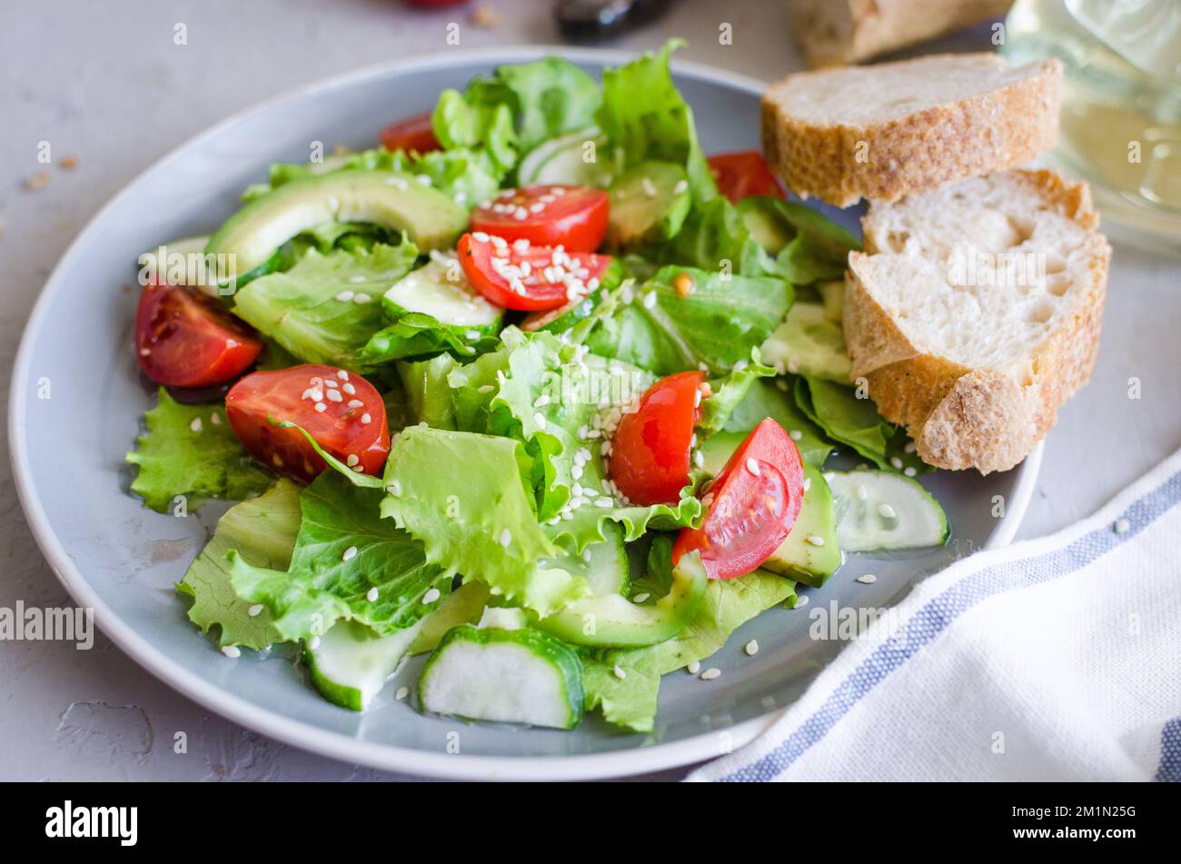 Fresh green organic salad with raw ingredients close up. Tasty salad