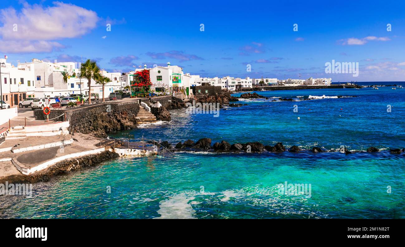 Lanzarote scenic places. view of Punta Mujeres traditional fishing village with crystal sea and white houses. popular  for natural swim pools. Canary Stock Photo