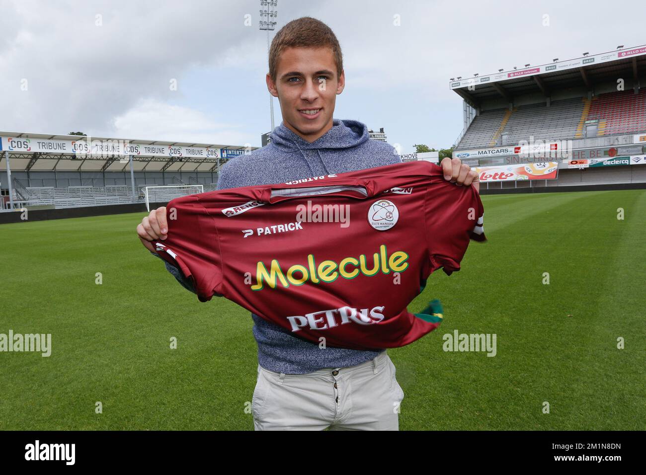 20120831 - WAREGEM, BELGIUM: Essevee's Thorgan Hazard poses with his new shirt after a press conference to present a new player at Belgian first division soccer team SV Zulte Waregem, Friday 31 August 2012 in Waregem. Today Essevee is presenting their latest signing, 19 year old Thorgan Hazard is coming over from Chelsea FC on a loan. BELGA PHOTO BRUNO FAHY Stock Photo