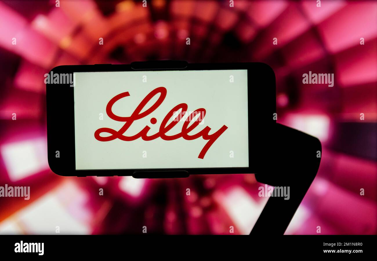 In this photo illustration, the logo of Eli Lilly is seen displayed on ...