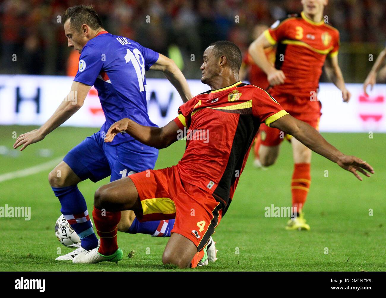 20120911 - BRUSSELS, BELGIUM: Croatian's Ivica Olic and Belgium's Vincent Kompany fight for the ball during the qualifying match between Belgium Red Devils and Croatia, Tuesday 11 September 2012 at the King Baudouin stadium, in Brussels. This is the second of ten qualifying games for the 2014 Soccer World Championships. BELGA PHOTO VIRGINIE LEFOUR Stock Photo