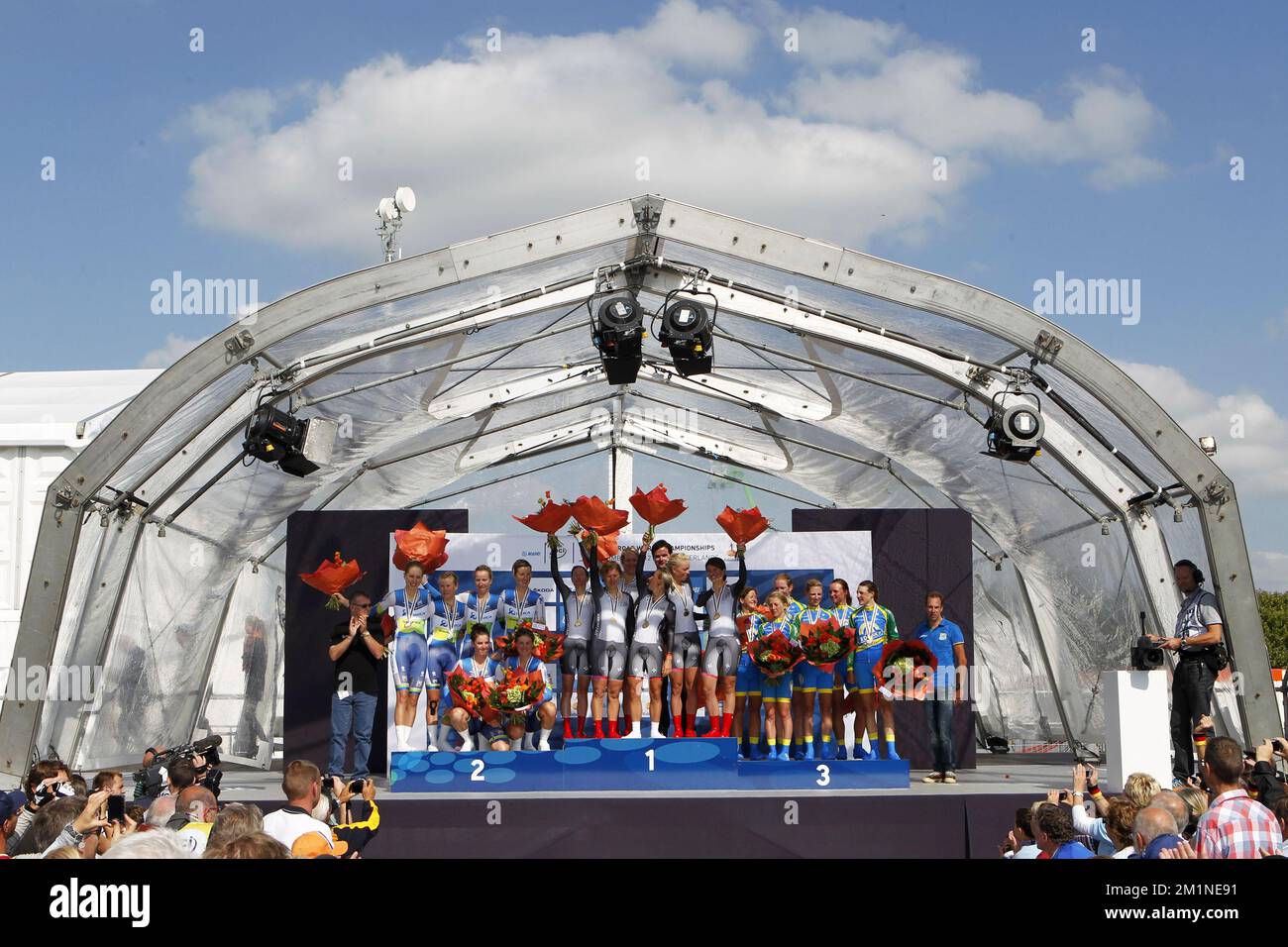 20120916 - VALKENBURG, NETHERLANDS: Team Orica - Ais, team Specialized-Lululemon and Team AA Drinks cyclists celebrate on the podium after the women elite team time trial, 34,2km from Sittard-Geleen to Valkenburg at the UCI Road World Cycling Championships, Sunday 16 September 2012 in Valkenburg, the Netherlands. BELGA PHOTO KRISTOF VAN ACCOM Stock Photo
