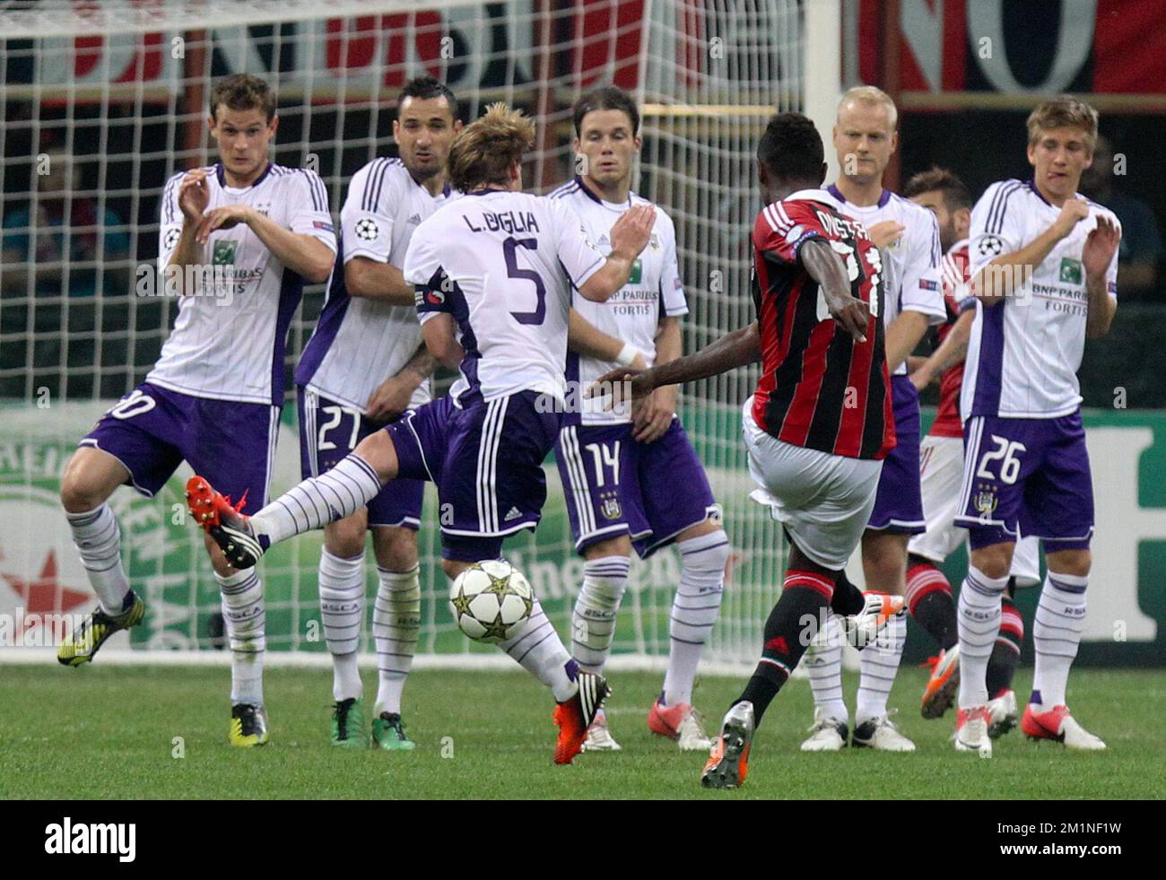 20120918 - MILAN, ITALY: Milan's Kevin Constant and Anderlech's wall of players pictured during the UEFA Champions League Group C soccer game between Italian Associazione Calcio Milan and Belgian first division soccer team RSC Anderlecht in Milan, Italy, Tuesday 18 September 2012. BELGA PHOTO VIRGINIE LEFOUR Stock Photo