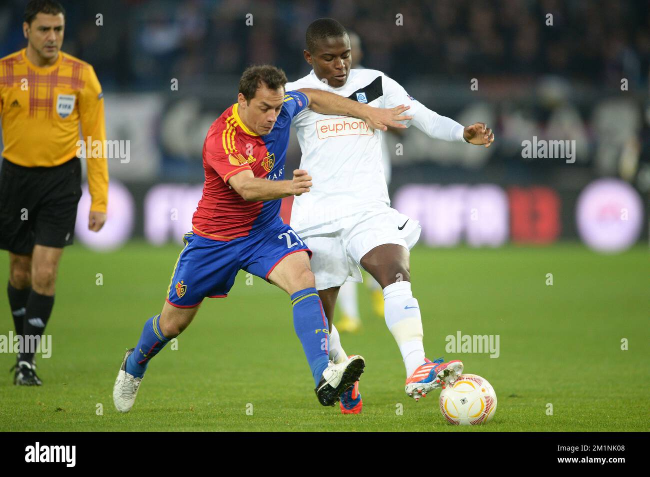 20121004 - BASEL, SWITZERLAND: Basel's Marcelo Diaz and Genk's Derrick Tshimanga fight for the ball during the match Racing Genk against FC Basel, a second game of the Europa League group stage (group G), in Basel, Switzerland, Thursday 04 October 2012. Genk won the first game and leads the group with 3 points. BELGA PHOTO YORICK JANSENS Stock Photo