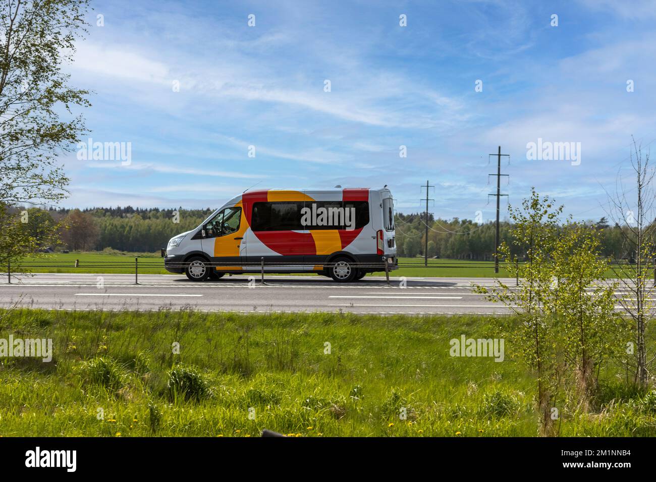 Service vehicles on Swedish roads, ambulance, police and person transportation Stock Photo