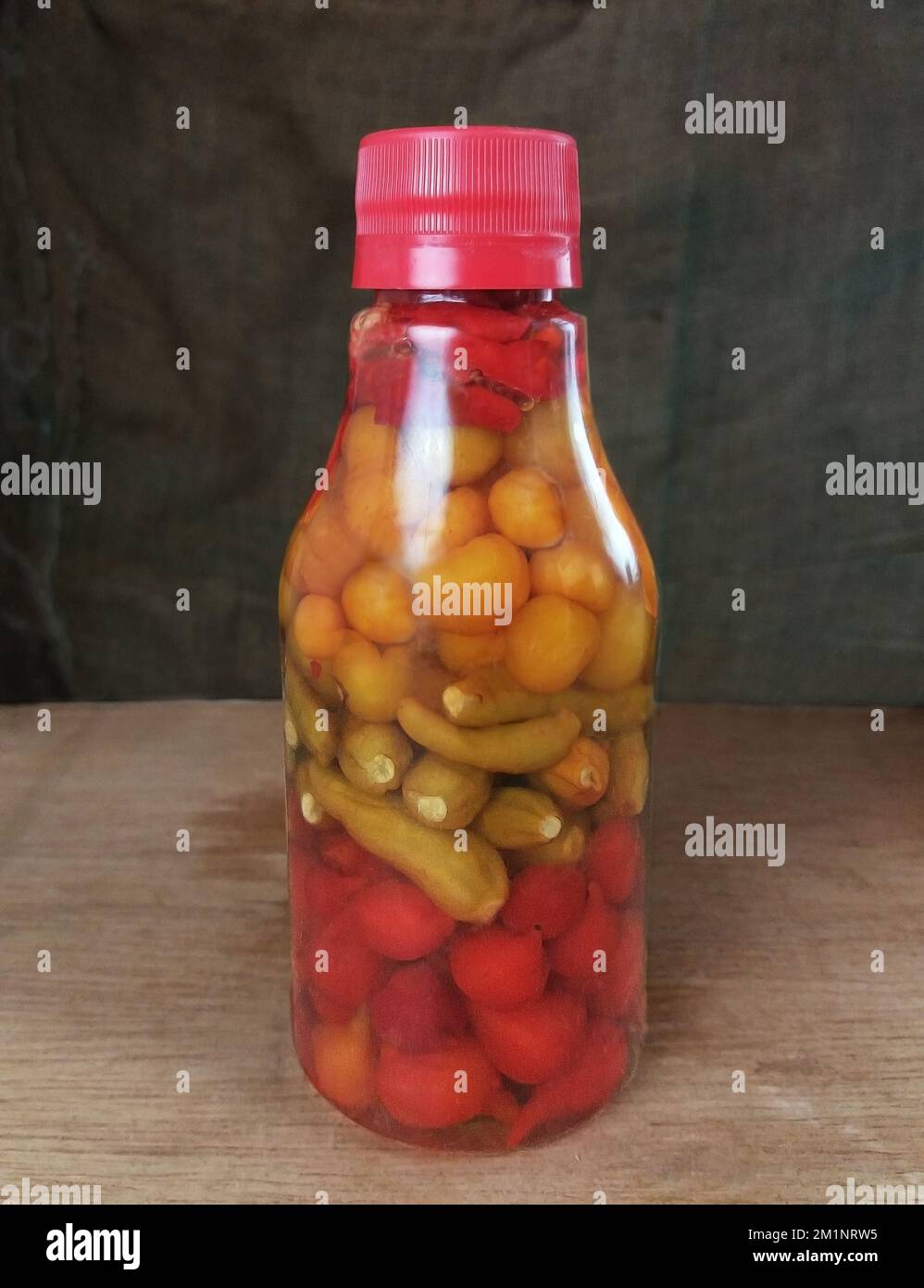 four kinds of peppers. 200 g jar of four types of peppers, preserved in