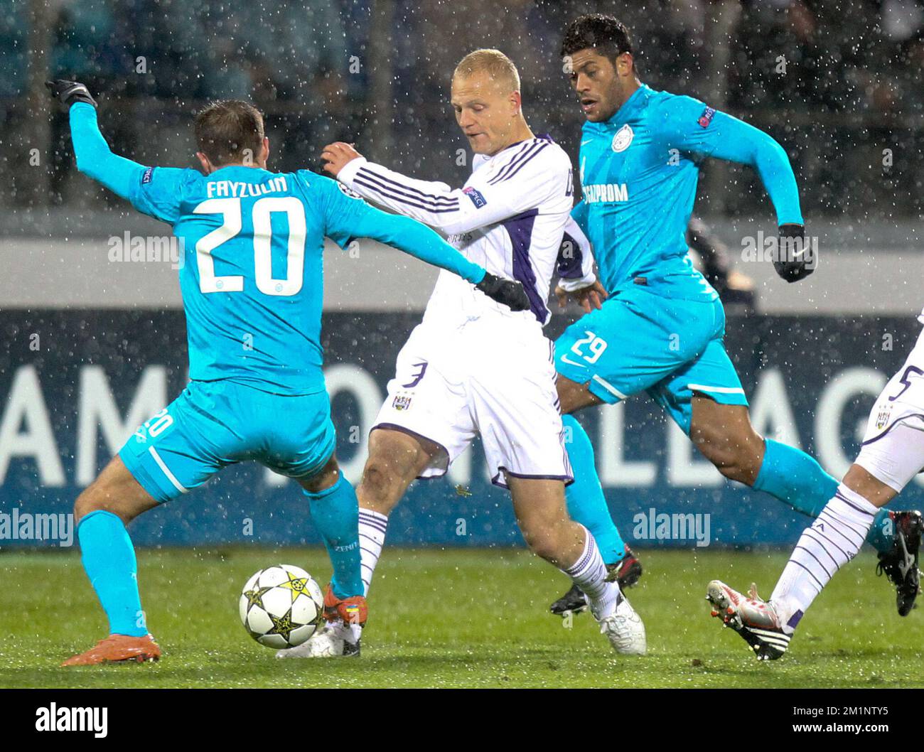 20121024 - SAINT PETERSBURG, RUSSIA: Zenit's Viktor Fayzulin and Anderlecht's Olivier Deschacht fight for the ball during the soccer match FC Zenit Saint Petersburg vs Belgian first division soccer team RSC Anderlecht, in group C of the UEFA Champions League tournament, Wednesday 24 October 2012 in Saint Petersburg, Russia. BELGA PHOTO VIRGINIE LEFOUR Stock Photo