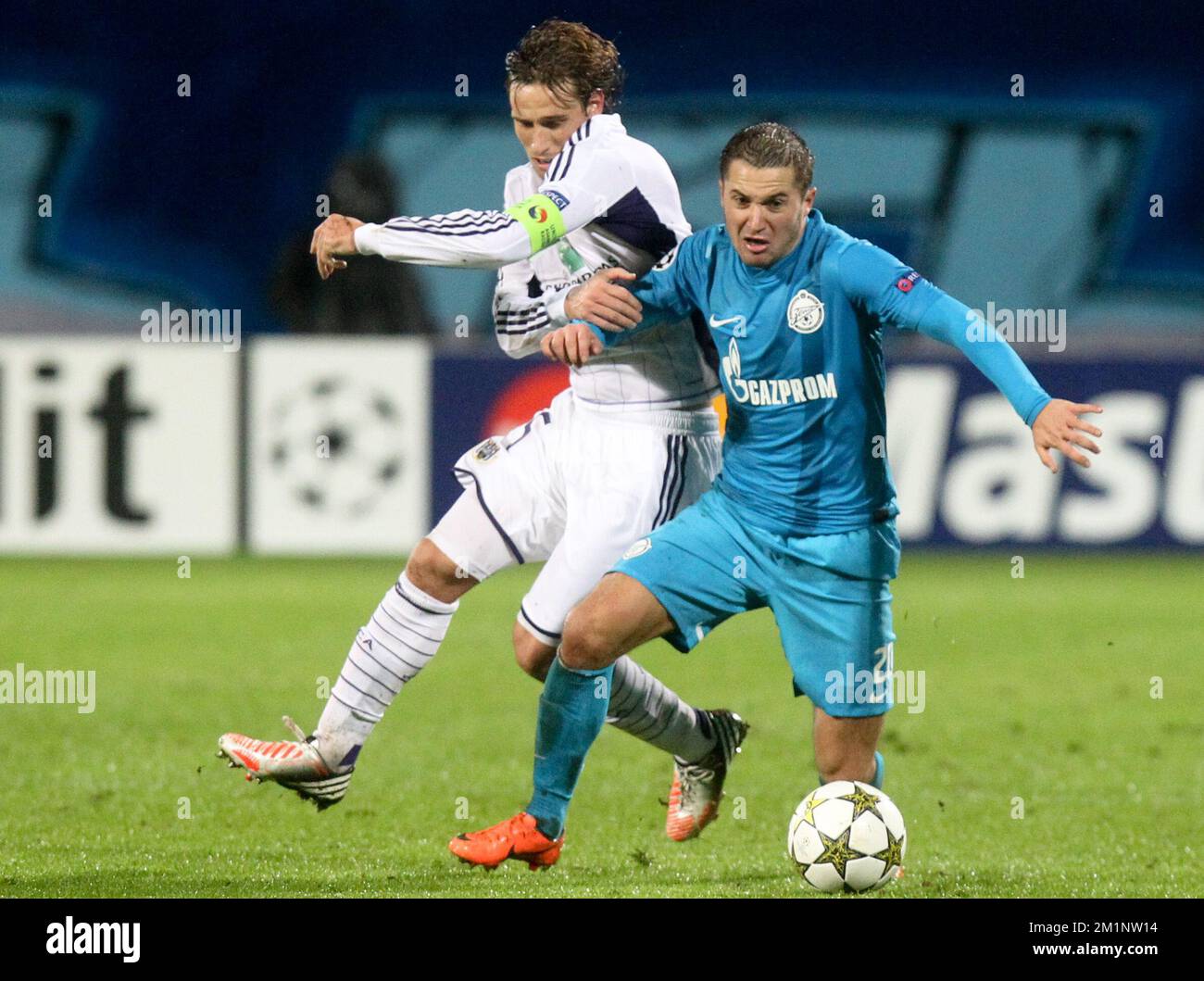 20121024 - SAINT PETERSBURG, RUSSIA: Anderlecht's Lucas Biglia and Zenit's Viktor Fayzulin fight for the ball during the soccer match FC Zenit Saint Petersburg vs Belgian first division soccer team RSC Anderlecht, in group C of the UEFA Champions League tournament, Wednesday 24 October 2012 in Saint Petersburg, Russia. BELGA PHOTO VIRGINIE LEFOUR Stock Photo