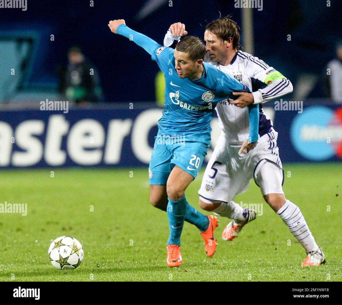 20121024 - SAINT PETERSBURG, RUSSIA: Anderlecht's Lucas Biglia (R) and Zenit's Viktor Fayzulin fight for the ball during the soccer match FC Zenit Saint Petersburg vs Belgian first division soccer team RSC Anderlecht, in group C of the UEFA Champions League tournament, Wednesday 24 October 2012 in Saint Petersburg, Russia. BELGA PHOTO VIRGINIE LEFOUR Stock Photo
