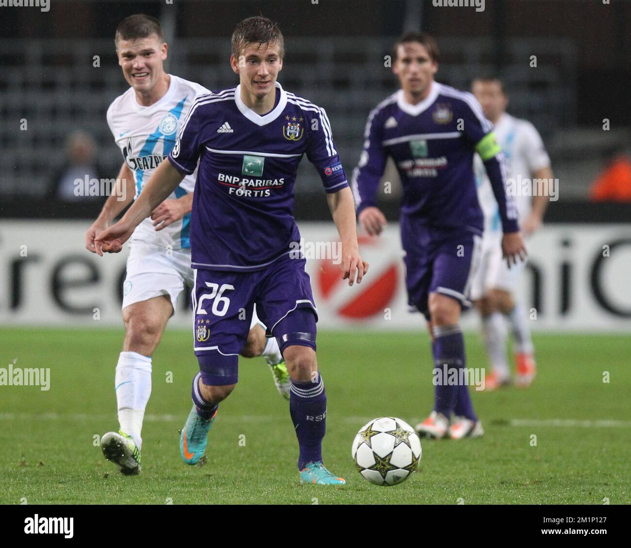20121106 - BRUSSELS, BELGIUM: Zenit's Igor Denisov and Anderlecht's Dennis Praet fight for the ball during the match between Belgian first division soccer team RSC Anderlecht and Russian team FC Zenit Saint Petersburg in group C of the UEFA Champions League tournament, Tuesday 06 November 2012 in Brussels. BELGA PHOTO VIRGINIE LEFOUR Stock Photo