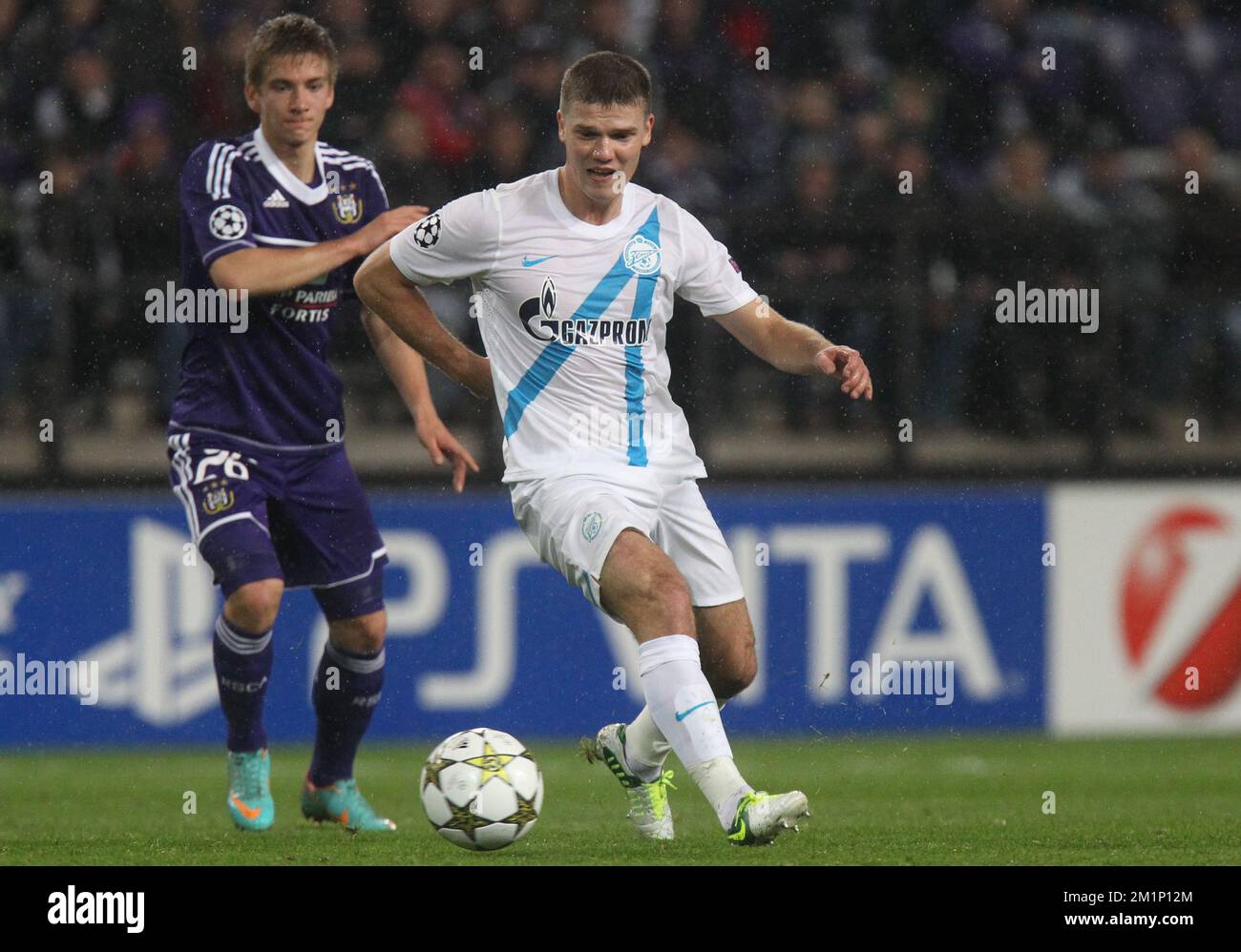 20121106 - BRUSSELS, BELGIUM: Anderlecht's Dennis Praet and Zenit's Igor Denisov fight for the ball during the match between Belgian first division soccer team RSC Anderlecht and Russian team FC Zenit Saint Petersburg in group C of the UEFA Champions League tournament, Tuesday 06 November 2012 in Brussels. BELGA PHOTO VIRGINIE LEFOUR Stock Photo